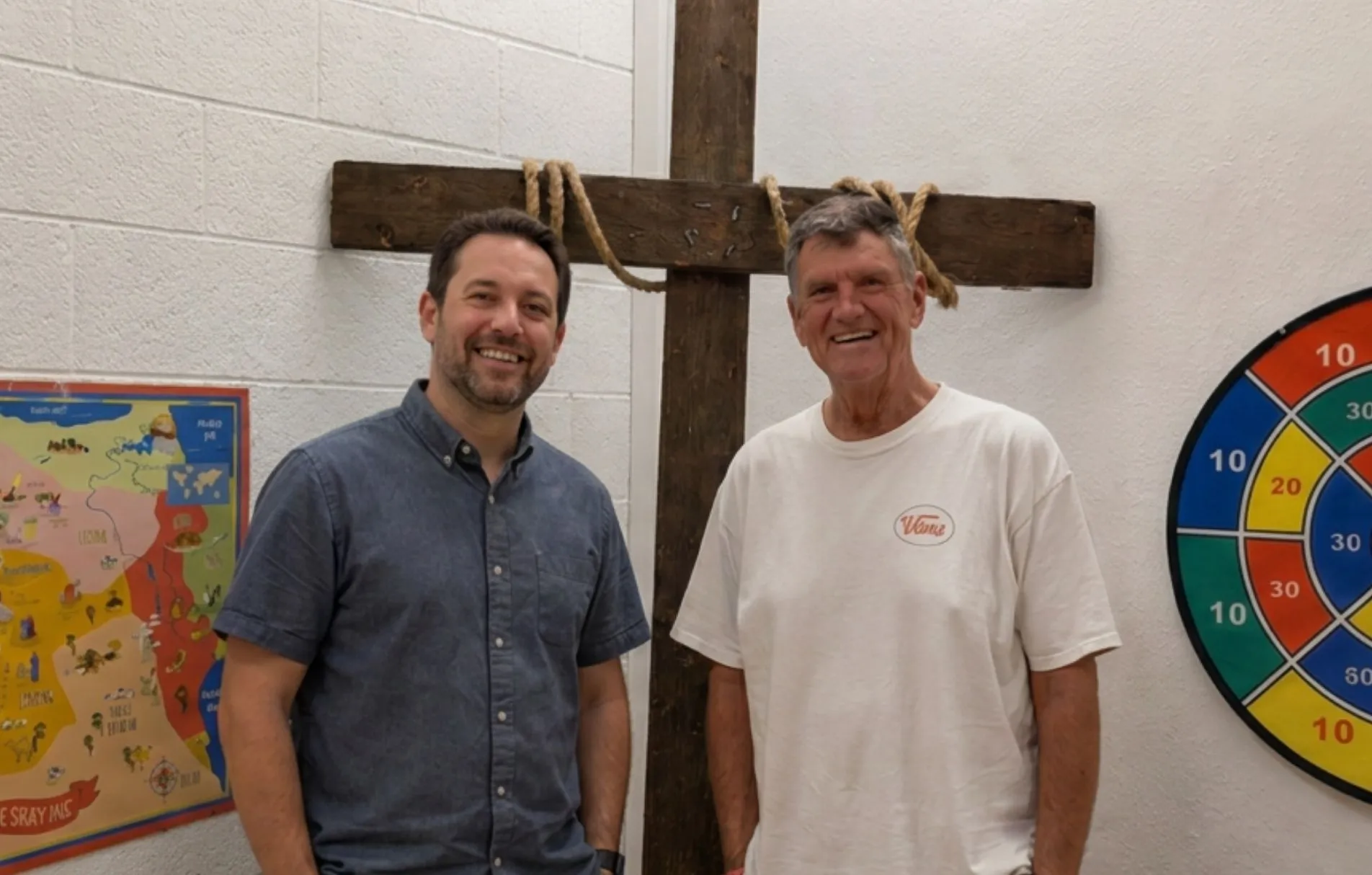 Jeff Buckner with a fellow disciple in front of a wooden cross